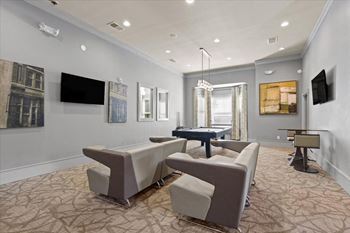 Clubhouse with a TV seating area and pool table.